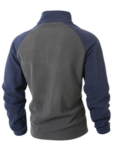 Rear view of outdoor fleece jacket showing color-block navy and grey textured fabric