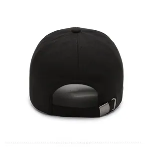Rear view of black cotton baseball cap showing adjustable silver metal buckle and fabric texture