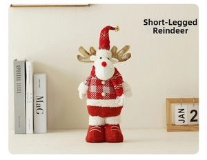 Detailed view of a small Christmas reindeer plush with golden antlers and red plaid sweater