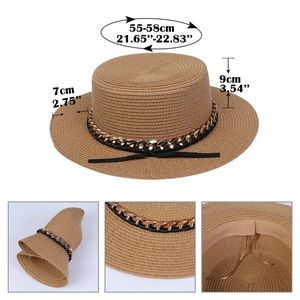 Detail view of foldable brown straw hat featuring a black gold chain trim and texture
