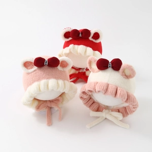 Adorable baby girl winter plush knit hats with red bows and ear protection design