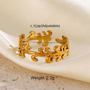 Macro shot of an adjustable gold-plated leaf ring on stone with weight and size data