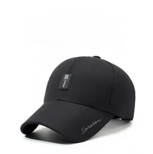 Detail of embroidered Narason logo and athletic stripes on black baseball cap brim