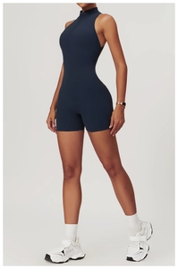 Detail of high-neck navy blue athletic bodysuit featuring a half-zip front and slim fit