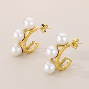 Detail view of 18k gold C-shape stainless steel earrings with three inlaid white pearls