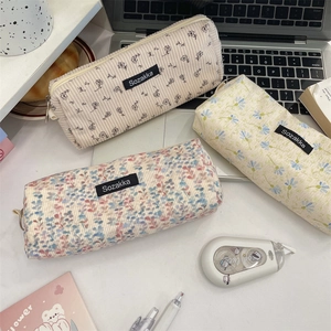 Detailed view of floral corduroy pencil cases with metal zippers in various patterns