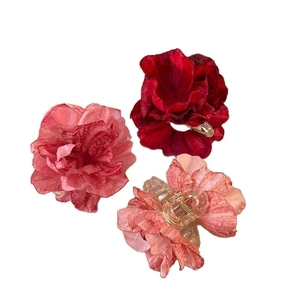 Three elegant rose flower hair claws in burgundy and pink chiffon for women's hairstyles
