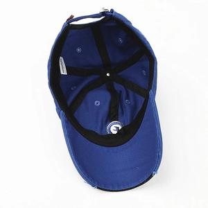 Detail of navy cotton baseball cap interior with sweatband and adjustable buckle