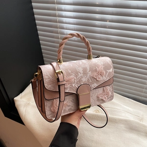 Pink lace embroidery crossbody bag with butterfly details and woven handle