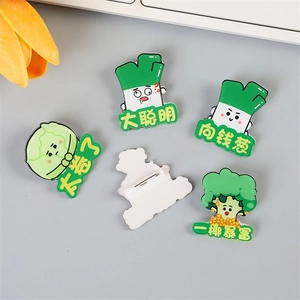 Cute cartoon vegetable acrylic brooches set with motivational puns on a light background