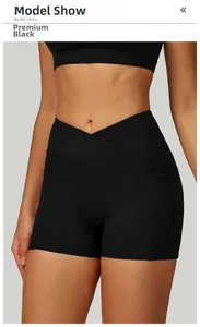 Close-up of crossover high waist yoga shorts with side pockets in premium black color