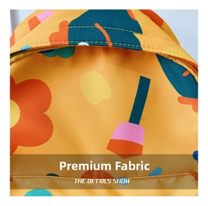 Close-up of yellow floral kids backpack showing durable fabric and double stitching