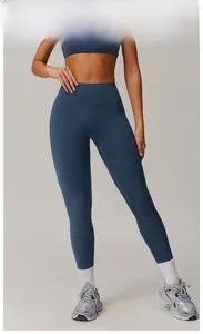 Detail view of high-waisted quick-dry yoga leggings in medallion blue finish