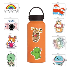 Detailed dimensions of waterproof PVC stickers showing rainbow, camera, and sloth designs