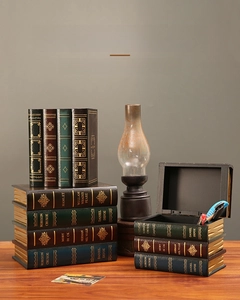 Detail of vintage European faux book storage box with gold foil print and leather texture