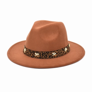 Detail of camel wool fedora hat featuring leopard band with star-shaped gold studs
