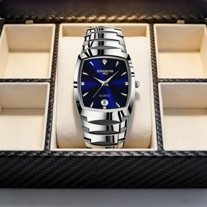 Detail view of quartz watch with blue dial and silver metal strap in carbon fiber box