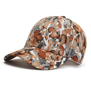 Baseball cap with brown abstract camouflage print and gold thread embroidery detail