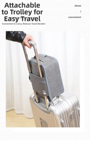Detail of grey travel shoe bag with back sleeve sliding over luggage trolley handle