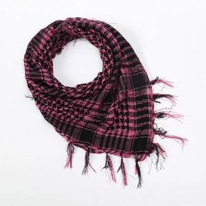 Detailed close-up of pink and black checkered shemagh scarf with fine fringe edges