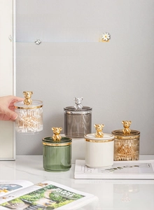 Detail of luxury cotton swab organizers with vertical texture and bear-shaped metal handles