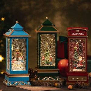 Vintage Christmas lanterns with snow globe scenes featuring Santa, snowman and trees