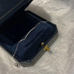 Minimalist silver diamond row bracelet with thin chain in a blue velvet gift box