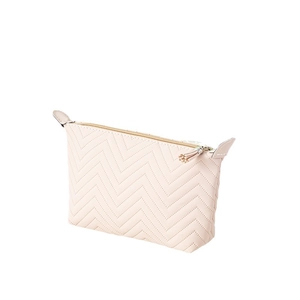 Pink dumpling shaped quilted makeup bag in faux leather with tassel zipper