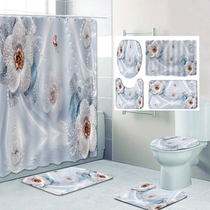 Detail of 4-piece floral bathroom set showing shower curtain, toilet mat and rugs