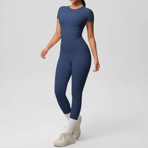 Detail view of navy blue yoga set featuring a high-waist legging with side phone pocket