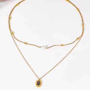 Double-layered golden stainless steel necklace with white pearl and black oval gemstone pendant