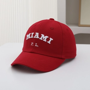 Close-up of white 3D embroidery showing MIAMI F.L. on red cotton baseball cap