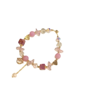 Pink and purple beaded planet bracelet with heart charms and adjustable pearl chain
