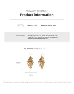 Detail view of gold leaf tassel earrings showing 7.5cm length and alloy material