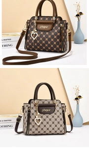Detail of luxury checkered handbags in coffee and beige with heart-shaped charms