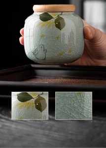 Macro shot of hand-painted underglaze rabbit pattern and ice-crack texture on ceramic jar