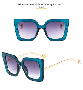 Detail of square blue resin sunglasses with grey gradient lenses and pearl gold temples