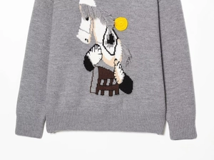 Detail of grey wool sweater featuring a horse embroidery with fringe mane and 3D texture