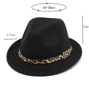 Detail of wool fedora hat featuring a leopard print band and golden buckle closure