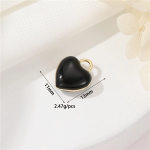 Detailed view of 11mm black heart charm with gold trim and size dimensions for DIY jewelry