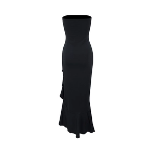 Detail of elegant black strapless evening dress with side slit and ruffled fishtail hem
