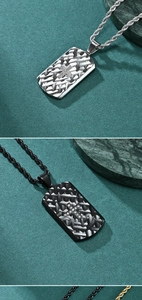 Detail of titanium steel dog tag necklaces with woven texture and crystal cross patterns