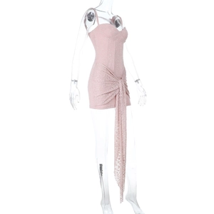 Detail view of pink lace bodycon dress with side drawstring ruching and ribbon ties