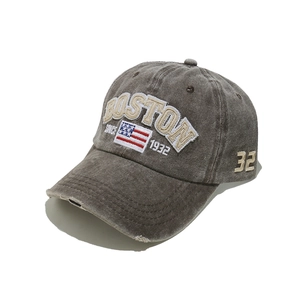 Detailed close-up of vintage washed cotton texture and Boston 32 embroidery on baseball cap