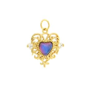 Detailed macro view of 18K gold-plated heart pendant with gradient blue crystal