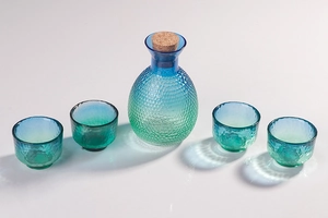 Japanese peacock blue hammered glass sake set with carafe, cork stopper and four cups