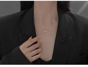 Close-up of S925 sterling silver smile necklace with gradient sparkling zircon stones