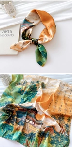 Detailed close-up of a 70cm silk scarf featuring traditional Chinese landscape art and calligraphy