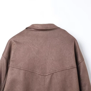 Detail view of the brown suede jacket showing collar stitching and textured matte finish