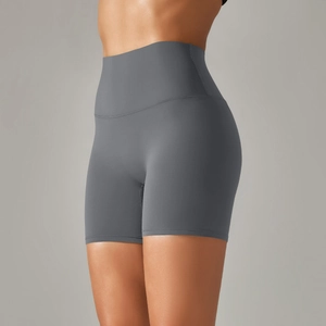Detail view of high-waisted seamless yoga shorts in dark grey with slimming fit
